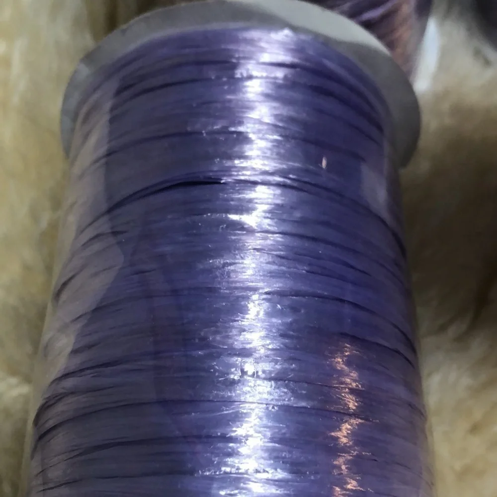 4 100 yard spools of lavender raffia